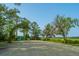 A gravel lot near lush trees with covered sitting area in a beautiful community at 9207 Bowen Corner Ave, Hanahan, SC 29410
