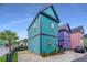 Unique, colorful two-story home with blue siding and a convenient parking area at 9207 Bowen Corner Ave, Hanahan, SC 29410