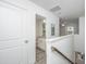 Hallway with view of a bathroom and a bedroom, and light grey floors at 9207 Bowen Corner Ave, Hanahan, SC 29410