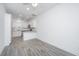 Bright living room features gray flooring and a view of the modern kitchen at 9207 Bowen Corner Ave, Hanahan, SC 29410