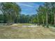 Open recreation area featuring lush greenery, trees, and open space for activities at 9207 Bowen Corner Ave, Hanahan, SC 29410