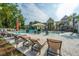 Relaxing community pool area featuring lounge chairs, tropical landscaping, and colorful rental homes at 9207 Bowen Corner Ave, Hanahan, SC 29410