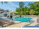 Inviting community pool area with lounge chairs, accessible lift, and shade umbrella at 9207 Bowen Corner Ave, Hanahan, SC 29410