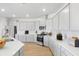 Modern kitchen featuring white cabinetry, stainless steel appliances, quartz countertops and lots of cabinet space at 1010 Swamp Rose Run, Summerville, SC 29485