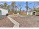 Spacious backyard featuring a fenced yard, sheds, and a patio with grill at 106 Two Wood Ct, Summerville, SC 29483