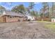 Backyard with brick and white siding and a patio with grill and seating area at 106 Two Wood Ct, Summerville, SC 29483