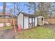 Fenced backyard featuring play equipment and storage sheds at 106 Two Wood Ct, Summerville, SC 29483