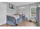 Cozy bedroom with a mini-split air conditioner, shelves, and a small fridge at 106 Two Wood Ct, Summerville, SC 29483