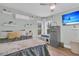 Bedroom including a ceiling fan, mini-split air conditioner, TV, and small fridge at 106 Two Wood Ct, Summerville, SC 29483