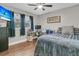 Cozy bedroom with a bed, desk, television, and natural light from the window at 106 Two Wood Ct, Summerville, SC 29483