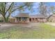 Charming brick home featuring lush yard, inviting curb appeal, and an attached two car garage at 106 Two Wood Ct, Summerville, SC 29483