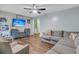 Inviting living room with a gray sectional sofa and a media center at 106 Two Wood Ct, Summerville, SC 29483