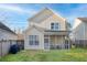 A backyard with a screened in porch, a grill, a grass lawn, and a two-story house with vinyl siding at 107 Diploma Dr, Ladson, SC 29485