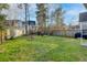 The backyard shows a grassy lawn with a basketball hoop, trees, and a wooden fence at 107 Diploma Dr, Ladson, SC 29485