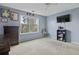 Bedroom with a large window with a wooden dresser and shelving units and baseball decor at 107 Diploma Dr, Ladson, SC 29485