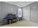 Bedroom with grey walls, carpeted floor, and filled with two arcade games with a window view at 107 Diploma Dr, Ladson, SC 29485