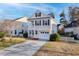 Charming two-story home with a well-manicured lawn and a spacious driveway at 107 Diploma Dr, Ladson, SC 29485