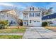 Charming two-story home with a well-manicured lawn and a spacious driveway at 107 Diploma Dr, Ladson, SC 29485