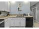 Updated kitchen with sleek black dishwasher, contrasting beautifully with the light countertops at 107 Diploma Dr, Ladson, SC 29485