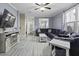 Comfortable living room with gray vinyl flooring, large sectional, and modern decor at 107 Diploma Dr, Ladson, SC 29485