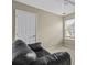 Neutral living room featuring a black leather sofa, door and window at 107 Diploma Dr, Ladson, SC 29485