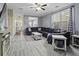Comfortable living room with gray vinyl flooring, large sectional, and modern decor at 107 Diploma Dr, Ladson, SC 29485