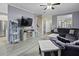 Comfortable living room with gray vinyl flooring, large sectional, and modern decor at 107 Diploma Dr, Ladson, SC 29485