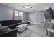 Comfortable living room with gray vinyl flooring, large sectional, and modern decor at 107 Diploma Dr, Ladson, SC 29485