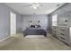 Spacious main bedroom with natural light, decorative touches, and ample closet space at 107 Diploma Dr, Ladson, SC 29485