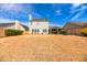 The level, fully-fenced backyard features an outdoor kitchen, covered patio and plenty of room at 109 Walnut Creek Rd, Charleston, SC 29414
