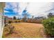Large backyard with a wood fence, shrubs, and a fire pit; perfect for outdoor enjoyment and privacy at 109 Walnut Creek Rd, Charleston, SC 29414