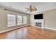 Spacious living room with fireplace, hardwood floors, crown molding, and large windows at 109 Walnut Creek Rd, Charleston, SC 29414