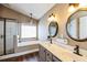 Elegant main bathroom featuring a soaking tub, a glass-enclosed shower and dual sinks at 109 Walnut Creek Rd, Charleston, SC 29414