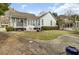 This backyard features a screened-in porch and a well-manicured lawn at 1106 Barfield St, Charleston, SC 29492