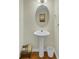 Small bathroom with a pedestal sink, a decorative mirror, and modern fixtures at 1106 Barfield St, Charleston, SC 29492