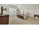 This spacious bedroom boasts neutral carpet, vaulted ceilings, and ample natural light from the large window at 1106 Barfield St, Charleston, SC 29492