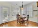 Bright dining area featuring hardwood floors, and a door leading to the outdoors at 1106 Barfield St, Charleston, SC 29492