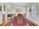 Elegant dining room with a chandelier, hardwood floors, and ample space for gatherings and entertaining at 1106 Barfield St, Charleston, SC 29492
