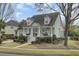 Inviting two-story home featuring a well-manicured lawn, covered porch, and traditional design elements at 1106 Barfield St, Charleston, SC 29492