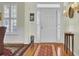 Inviting foyer with gleaming hardwood floors, classic decor, and bright natural light creates a warm welcome at 1106 Barfield St, Charleston, SC 29492
