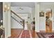 Welcoming foyer features gleaming hardwood floors, staircase, and elegant decor for a grand entrance at 1106 Barfield St, Charleston, SC 29492