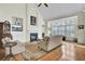 Cozy living room with a fireplace, vaulted ceilings, and large windows, creating a bright and inviting space at 1106 Barfield St, Charleston, SC 29492