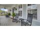 Inviting front porch featuring rocking chairs, plants, and classic architectural details for relaxing outdoors at 1106 Barfield St, Charleston, SC 29492