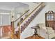 Entry stairway with carpet runner, hardwood floors, and traditional decor at 1106 Barfield St, Charleston, SC 29492