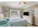 Bright bedroom with a large window, a ceiling fan, and a neutral color palette at 1204 Basildon Rd, Mount Pleasant, SC 29466