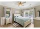 Comfortable bedroom with plenty of natural light, ceiling fan, and neutral decor at 1204 Basildon Rd, Mount Pleasant, SC 29466
