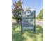 Community sign listing amenities including a dog park, tennis courts, pool, sports fields, lake pavilion, and trails at 1204 Basildon Rd, Mount Pleasant, SC 29466