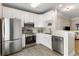 Modern kitchen with stainless steel appliances, white cabinets, and a breakfast bar at 1204 Basildon Rd, Mount Pleasant, SC 29466