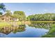 Lake pavilion with a dock on a still lake reflecting the sky and trees at 1204 Basildon Rd, Mount Pleasant, SC 29466