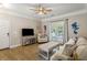 Bright living room featuring comfortable furniture, a ceiling fan, and access to a balcony at 1204 Basildon Rd, Mount Pleasant, SC 29466